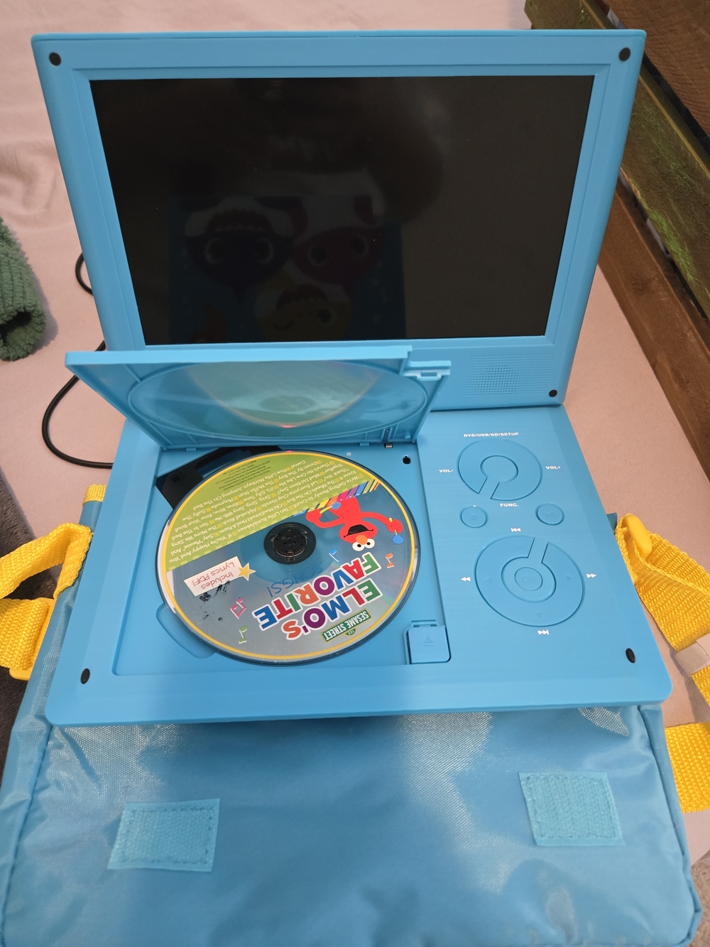 Portable Kids DVD Player in Bright Turquoise with Yellow Strap